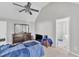 Spacious main bedroom with a vaulted ceiling, ceiling fan and ensuite bathroom at 11113 N Radner Way, Raleigh, NC 27613