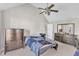Spacious main bedroom with a vaulted ceiling, ceiling fan and ensuite bathroom at 11113 N Radner Way, Raleigh, NC 27613