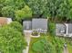 Charming home with lush landscaping, manicured lawn, and a two-car garage nestled among mature trees at 113 Bergeron Way, Cary, NC 27519