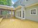 A spacious back deck with access to a screened-in porch on a sunny day at 113 Bergeron Way, Cary, NC 27519