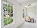 Cozy bedroom nook with chair, side table, and natural light at 113 Bergeron Way, Cary, NC 27519
