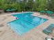 A beautiful community pool with marked lanes and ample lounge chairs, perfect for relaxation and recreation at 113 Bergeron Way, Cary, NC 27519