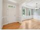 Inviting foyer with gleaming hardwood floors, fresh paint and elegant trim at 113 Bergeron Way, Cary, NC 27519