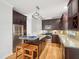 Well-appointed kitchen with stainless steel appliances, granite countertops, and dark cabinetry at 113 Bergeron Way, Cary, NC 27519