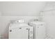Bright laundry room featuring a modern washer and dryer and ample storage space at 113 Bergeron Way, Cary, NC 27519