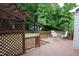 Inviting backyard deck with a pergola, surrounded by lush greenery and a fenced yard at 114 Calebra Way, Cary, NC 27519