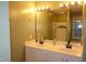 Well-lit bathroom featuring double sink vanity with white cabinets and a glass-enclosed shower at 114 Calebra Way, Cary, NC 27519