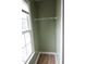 Walk-in closet with natural light, shelves and hardwood floors at 114 Calebra Way, Cary, NC 27519