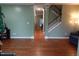 Open-concept living room featuring hardwood floors and a staircase at 114 Calebra Way, Cary, NC 27519