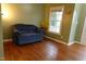 Comfortable living room area with hardwood floors and bright window at 114 Calebra Way, Cary, NC 27519