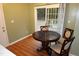 Cozy breakfast nook with a round table and view of outdoor patio through sliding glass doors at 114 Calebra Way, Cary, NC 27519