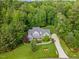 Beautiful aerial view of home with lush landscaping and mature trees in a sought-after community at 114 Margaret Mann Way, Pittsboro, NC 27312