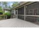Exterior view of the gray deck and screened porch connected to the house at 114 Margaret Mann Way, Pittsboro, NC 27312