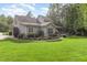 Exterior view of the house with a well manicured yard and a patio at 114 Margaret Mann Way, Pittsboro, NC 27312