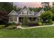 Charming home featuring inviting front porch and professionally landscaped front yard at 114 Margaret Mann Way, Pittsboro, NC 27312