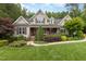 Charming craftsman home with stone accents, a welcoming front porch, and lush landscaping at 114 Margaret Mann Way, Pittsboro, NC 27312