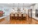 Spacious kitchen with center island, stainless steel appliances, and hardwood floors at 114 Margaret Mann Way, Pittsboro, NC 27312