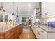 Bright kitchen with center island, granite countertops, and access to the breakfast area at 114 Margaret Mann Way, Pittsboro, NC 27312
