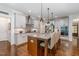Kitchen featuring granite counters, stainless steel appliances, and breakfast bar at 114 Margaret Mann Way, Pittsboro, NC 27312