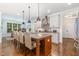 Bright kitchen featuring a center island with seating and stainless steel appliances at 114 Margaret Mann Way, Pittsboro, NC 27312