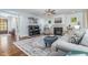 Bright living room featuring fireplace, grand piano, and comfortable furniture perfect for relaxation at 114 Margaret Mann Way, Pittsboro, NC 27312
