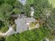 Aerial view of a home with beautiful landscaping, backyard patio, and a tranquil outdoor living area at 1300 Heritage Club Ave, Wake Forest, NC 27587