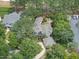 Aerial view of a well-maintained property with a patio area and lush surrounding greenery at 1300 Heritage Club Ave, Wake Forest, NC 27587
