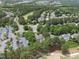 An aerial view of a residential area near a golf course, showcasing the neighborhood layout and landscape at 1300 Heritage Club Ave, Wake Forest, NC 27587