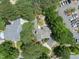Bird's eye view showcasing home's layout and backyard with a fire pit, surrounded by mature trees at 1300 Heritage Club Ave, Wake Forest, NC 27587