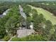 An aerial view of the neighborhood showcasing the lush green spaces and surrounding golf course at 1300 Heritage Club Ave, Wake Forest, NC 27587