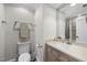 Powder bathroom featuring vanity with granite counters, updated lighting and fixtures at 1300 Heritage Club Ave, Wake Forest, NC 27587