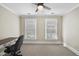 Bright bedroom with neutral carpet, a ceiling fan, and lots of natural light at 1300 Heritage Club Ave, Wake Forest, NC 27587