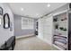 Bedroom with Murphy bed, built-in shelving and neutral tones at 1300 Heritage Club Ave, Wake Forest, NC 27587