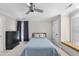 Comfortable bedroom with window seat, carpet, and light blue bedding set at 1300 Heritage Club Ave, Wake Forest, NC 27587