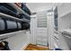 Organized walk-in closet with ample storage and shelving units at 1300 Heritage Club Ave, Wake Forest, NC 27587