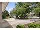 Circular driveway leads to this charming home with mature landscaping and inviting curb appeal at 1300 Heritage Club Ave, Wake Forest, NC 27587
