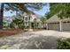 Traditional two-story home showcasing meticulous landscaping, a three-car garage, and a welcoming facade at 1300 Heritage Club Ave, Wake Forest, NC 27587