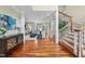 Elegant foyer with hardwood floors, staircase, and a view into the spacious living room at 1300 Heritage Club Ave, Wake Forest, NC 27587