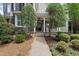 Inviting front entrance featuring stone accents, landscaped pathway, and covered porch at 1300 Heritage Club Ave, Wake Forest, NC 27587