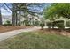 Traditional home featuring landscaped yard, detached garage, and inviting front entrance at 1300 Heritage Club Ave, Wake Forest, NC 27587