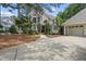 Well-maintained home with landscaped front yard, featuring a detached two-car garage at 1300 Heritage Club Ave, Wake Forest, NC 27587