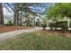 Traditional home with a landscaped front yard and a detached two-car garage at 1300 Heritage Club Ave, Wake Forest, NC 27587