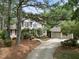 Traditional two-story home with landscaped front yard and detached two-car garage at 1300 Heritage Club Ave, Wake Forest, NC 27587