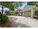 Home with landscaped front yard and detached two-car garage with ample driveway space at 1300 Heritage Club Ave, Wake Forest, NC 27587