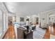 Spacious living room with hardwood floors, comfortable seating, and ample natural light at 1300 Heritage Club Ave, Wake Forest, NC 27587