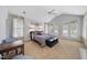 Spacious main bedroom with vaulted ceiling, natural light, and sitting area at 1300 Heritage Club Ave, Wake Forest, NC 27587