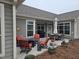 Inviting back patio featuring comfortable seating, a grill, and ample space for outdoor gatherings at 1357 Prevenient Dr, Wake Forest, NC 27587