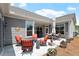 Backyard patio featuring outdoor seating and well-maintained landscaping at 1357 Prevenient Dr, Wake Forest, NC 27587