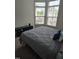 Bedroom with a large bed and window views at 1357 Prevenient Dr, Wake Forest, NC 27587