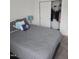Cozy bedroom featuring a queen-size bed with decorative pillows and a closet with sliding doors at 1357 Prevenient Dr, Wake Forest, NC 27587